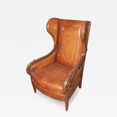 A Late 18th Century French Louis XVI Walnut Reclining Wing Chair