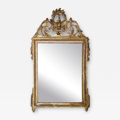A Late Louis XVI Giltwood Mirror