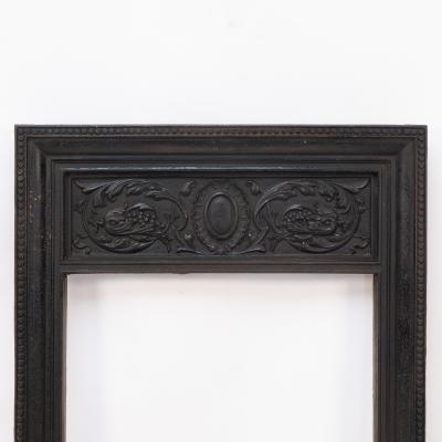 A Late Victorian Fireplace with Stylized Floral Details to the Top