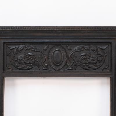 A Late Victorian Fireplace with Stylized Floral Details to the Top