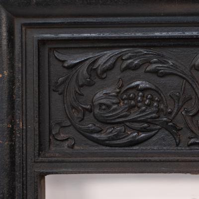 A Late Victorian Fireplace with Stylized Floral Details to the Top