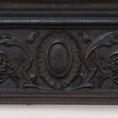 A Late Victorian Fireplace with Stylized Floral Details to the Top