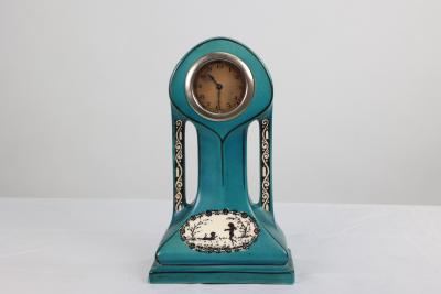 A Little Turquoise Blue Dressing Table Clock Decorated with Cherubs by a Tree