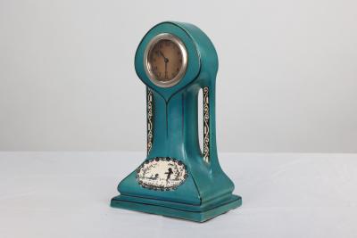 A Little Turquoise Blue Dressing Table Clock Decorated with Cherubs by a Tree