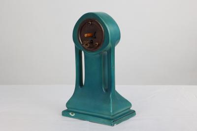 A Little Turquoise Blue Dressing Table Clock Decorated with Cherubs by a Tree