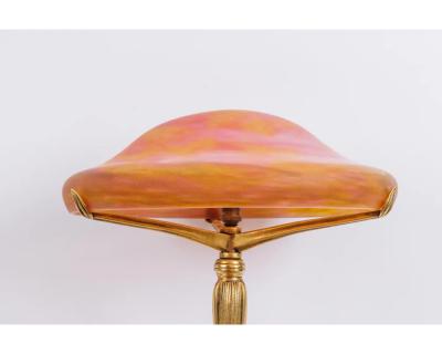 A Louis Majorelle and Daum Nancy Gilt Bronze and Pink Glass Table Lamp