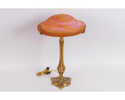 A Louis Majorelle and Daum Nancy Gilt Bronze and Pink Glass Table Lamp