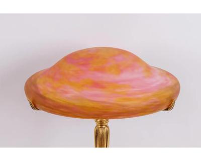 A Louis Majorelle and Daum Nancy Gilt Bronze and Pink Glass Table Lamp