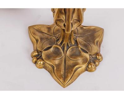 A Louis Majorelle and Daum Nancy Gilt Bronze and Pink Glass Table Lamp