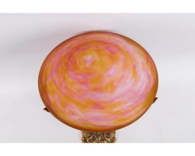 A Louis Majorelle and Daum Nancy Gilt Bronze and Pink Glass Table Lamp