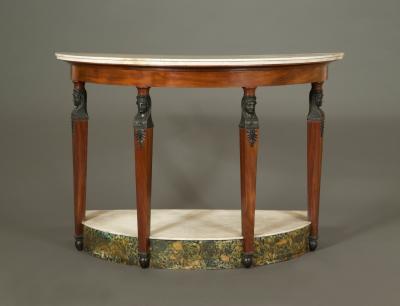 A MAHOGANY AND FAUX BRONZE DEMILUNE PIER TABLE IN THE RETOUR D EGYPT TASTE