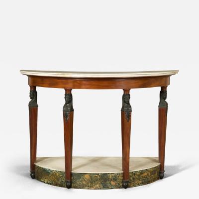 A MAHOGANY AND FAUX BRONZE DEMILUNE PIER TABLE IN THE RETOUR D EGYPT TASTE