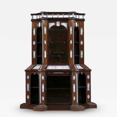 A MONUMENTAL WALNUT EBONISED DISPLAY CABINET MOUNTED WITH VICTORIA