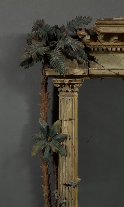 A MOST UNUSUAL FINELY CARVED AND NATURALISTICALLY PAINTED MIRROR