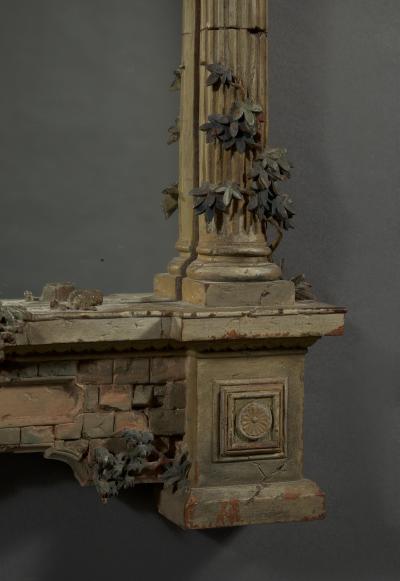 A MOST UNUSUAL FINELY CARVED AND NATURALISTICALLY PAINTED MIRROR