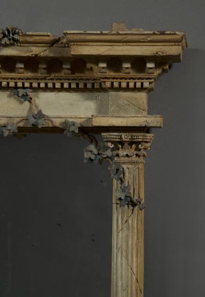 A MOST UNUSUAL FINELY CARVED AND NATURALISTICALLY PAINTED MIRROR