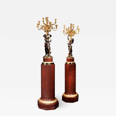 A Magnificent Pair of Louis XVI Candelabra after Clodion