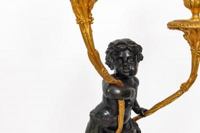 A Magnificent Pair of Louis XVI Style Gilt Bronze Candelabra on Porphyry Bases