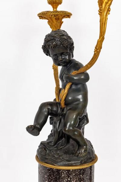 A Magnificent Pair of Louis XVI Style Gilt Bronze Candelabra on Porphyry Bases