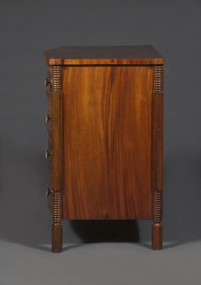 A Mahogany Bow Fronted Commode with Unusual Reeded Column Corner Posts and Feet
