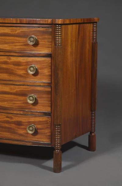 A Mahogany Bow Fronted Commode with Unusual Reeded Column Corner Posts and Feet