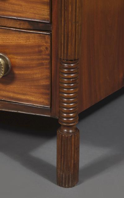 A Mahogany Bow Fronted Commode with Unusual Reeded Column Corner Posts and Feet