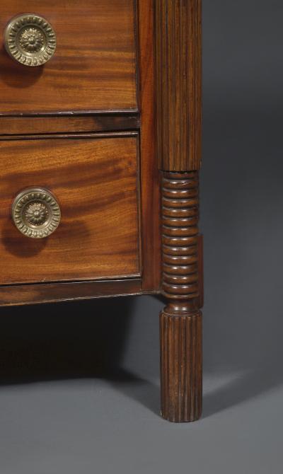 A Mahogany Bow Fronted Commode with Unusual Reeded Column Corner Posts and Feet