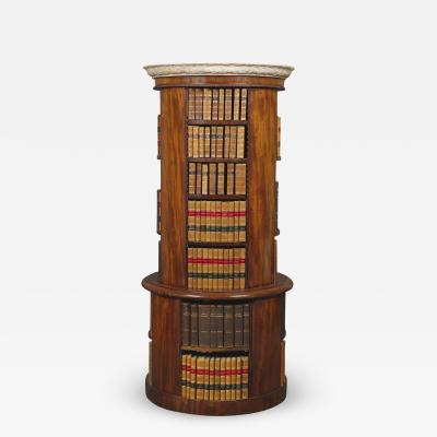 A Mahogany Circular Bookcase With A Statuary Dished Marble Top