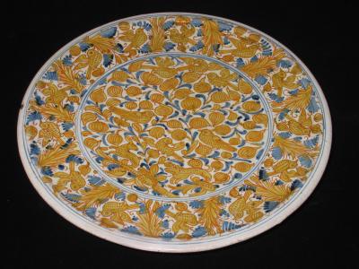 A Majolica Alzata Charger with Stand with Animal and Vegetal Motifs