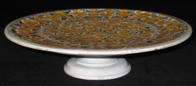 A Majolica Alzata Charger with Stand with Animal and Vegetal Motifs