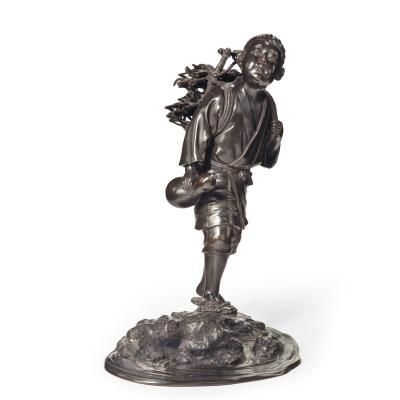 A Meiji period bronze of a boy carrying twigs