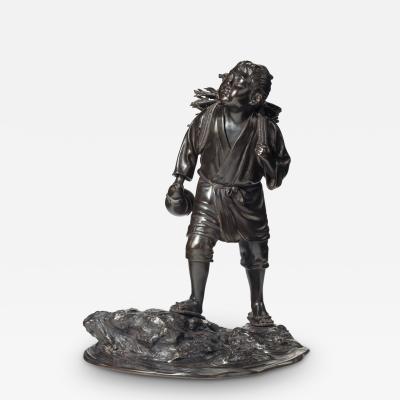 A Meiji period bronze of a boy carrying twigs