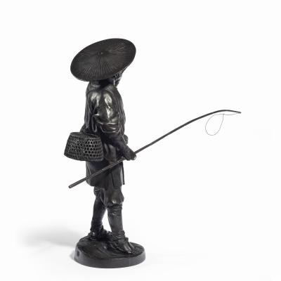A Meiji period bronze of a cricket catcher