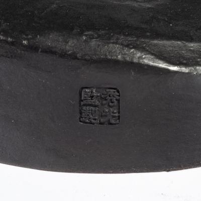 A Meiji period bronze of a cricket catcher