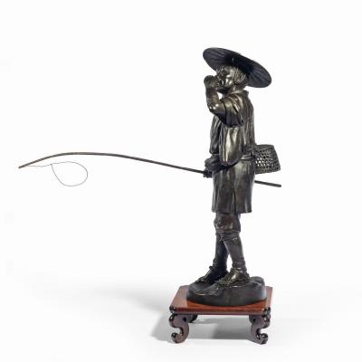 A Meiji period bronze of a cricket catcher