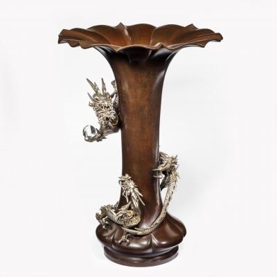 A Meiji period bronze trumpet vase with a dragon
