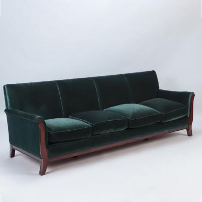 A Mid Century Modern French large sofa with green velvet upholstery circa 1945 