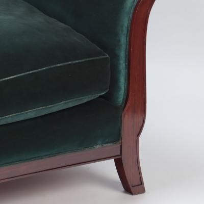 A Mid Century Modern French large sofa with green velvet upholstery circa 1945 