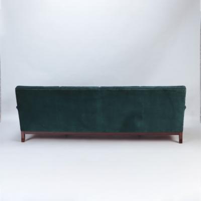 A Mid Century Modern French large sofa with green velvet upholstery circa 1945 