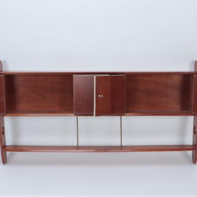 A Mid Century Modern walnut wall hung head board Circa 1960