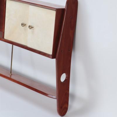 A Mid Century Modern walnut wall hung head board Circa 1960