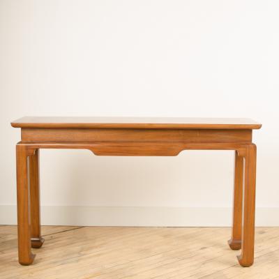 A Mid Century mahogany console in the manner of J Mont circa 1950 