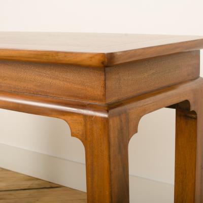 A Mid Century mahogany console in the manner of J Mont circa 1950 
