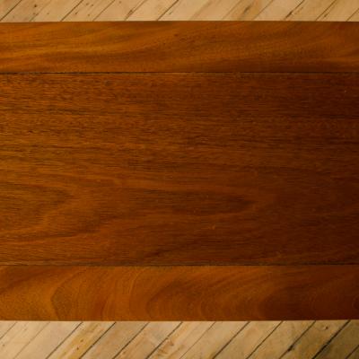 A Mid Century mahogany console in the manner of J Mont circa 1950 