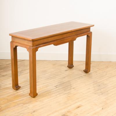 A Mid Century mahogany console in the manner of J Mont circa 1950 