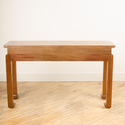 A Mid Century mahogany console in the manner of J Mont circa 1950 