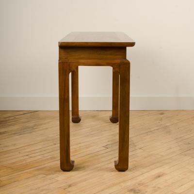 A Mid Century mahogany console in the manner of J Mont circa 1950 