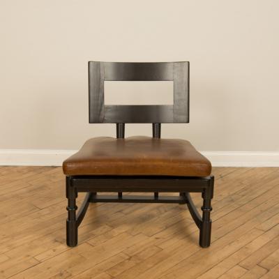 A Mid Century single armchair with leather seat