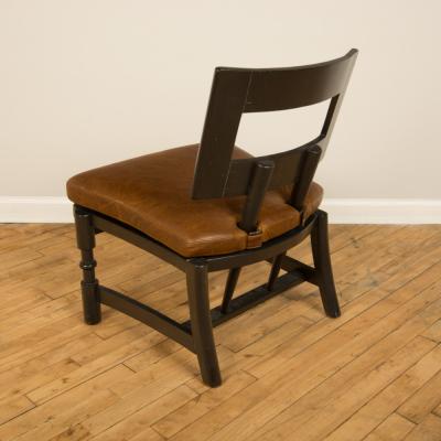 A Mid Century single armchair with leather seat