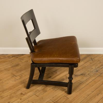 A Mid Century single armchair with leather seat